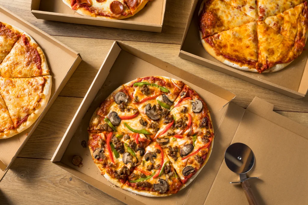 Assorted pizza delivery options with different toppings and flavors.